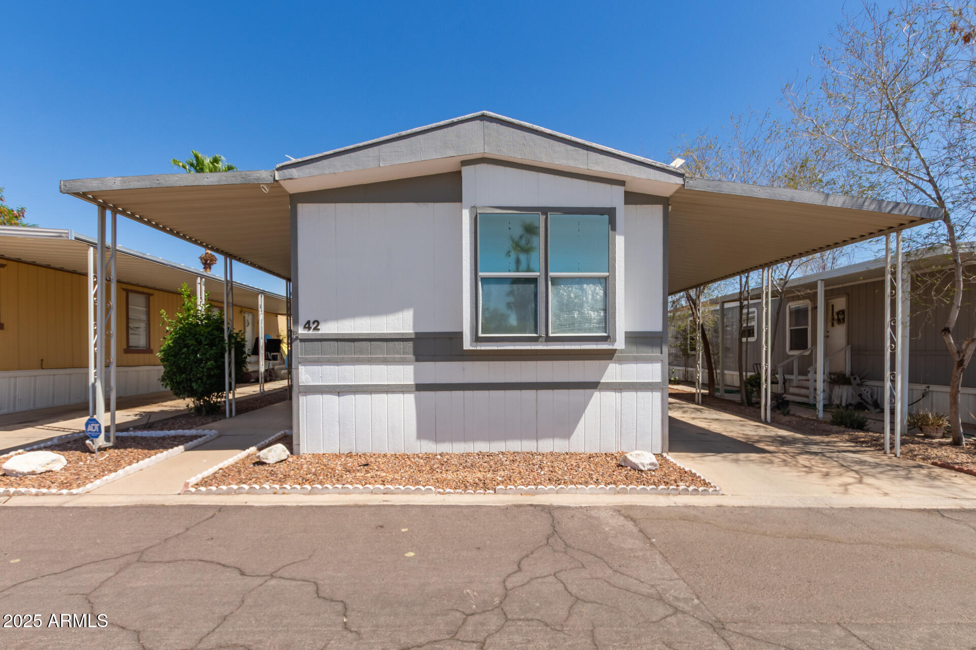 1221 North Dysart Road, Unit 42 Avondale, AZ 85323 - Photo 1 of 23 a view of a house with a outdoor space