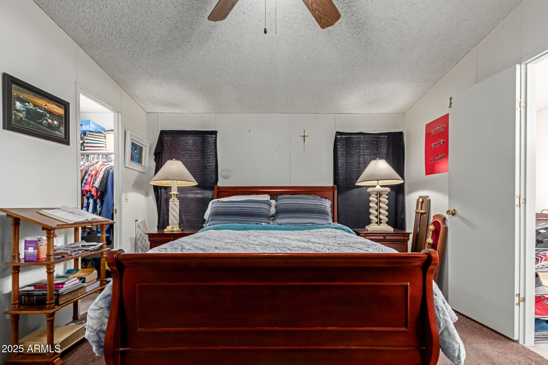 1221 North Dysart Road, Unit 42 Avondale, AZ 85323 - Photo 11 of 23 a bedroom with furniture and a book shelf