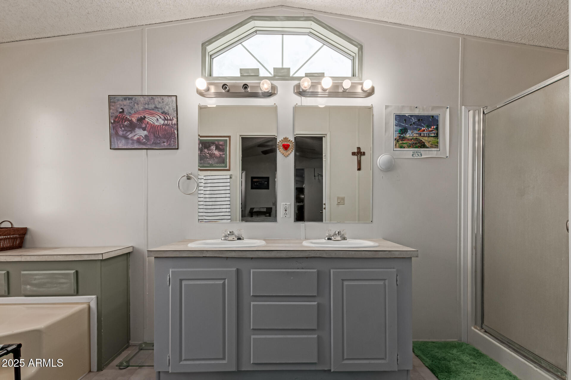 1221 North Dysart Road, Unit 42 Avondale, AZ 85323 - Photo 13 of 23 a bathroom with a sink and a mirror