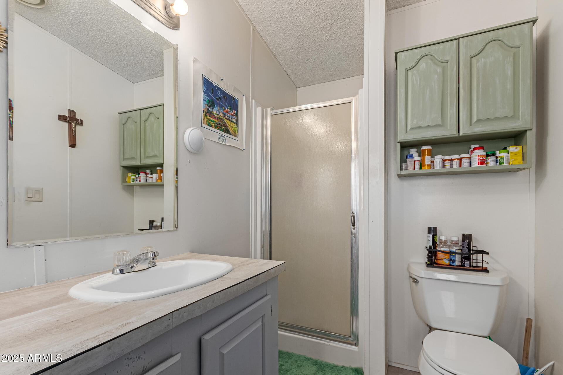 1221 North Dysart Road, Unit 42 Avondale, AZ 85323 - Photo 15 of 23 a bathroom with a granite countertop toilet sink and mirror