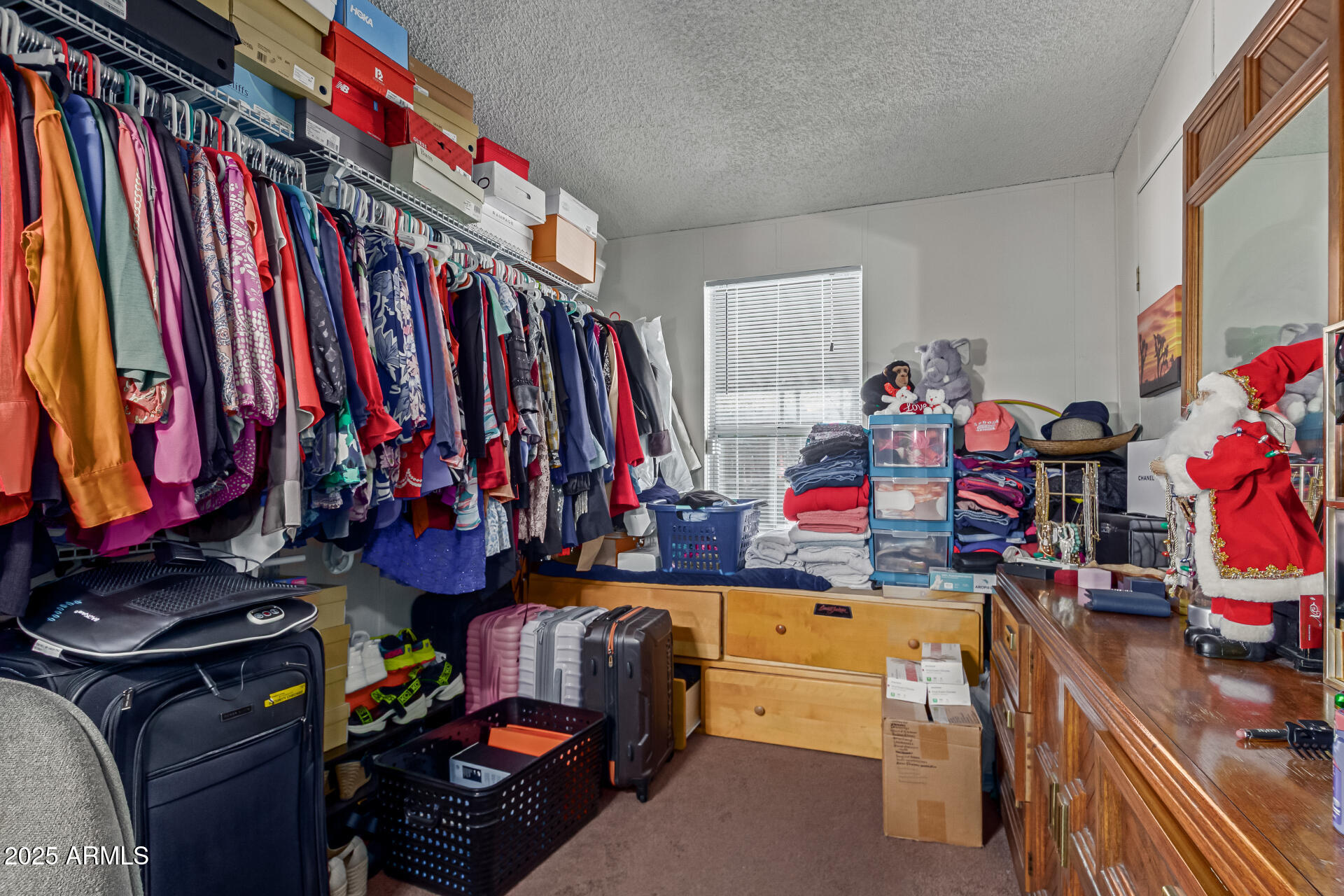 1221 North Dysart Road, Unit 42 Avondale, AZ 85323 - Photo 18 of 23 a view of walk in closet with clothes
