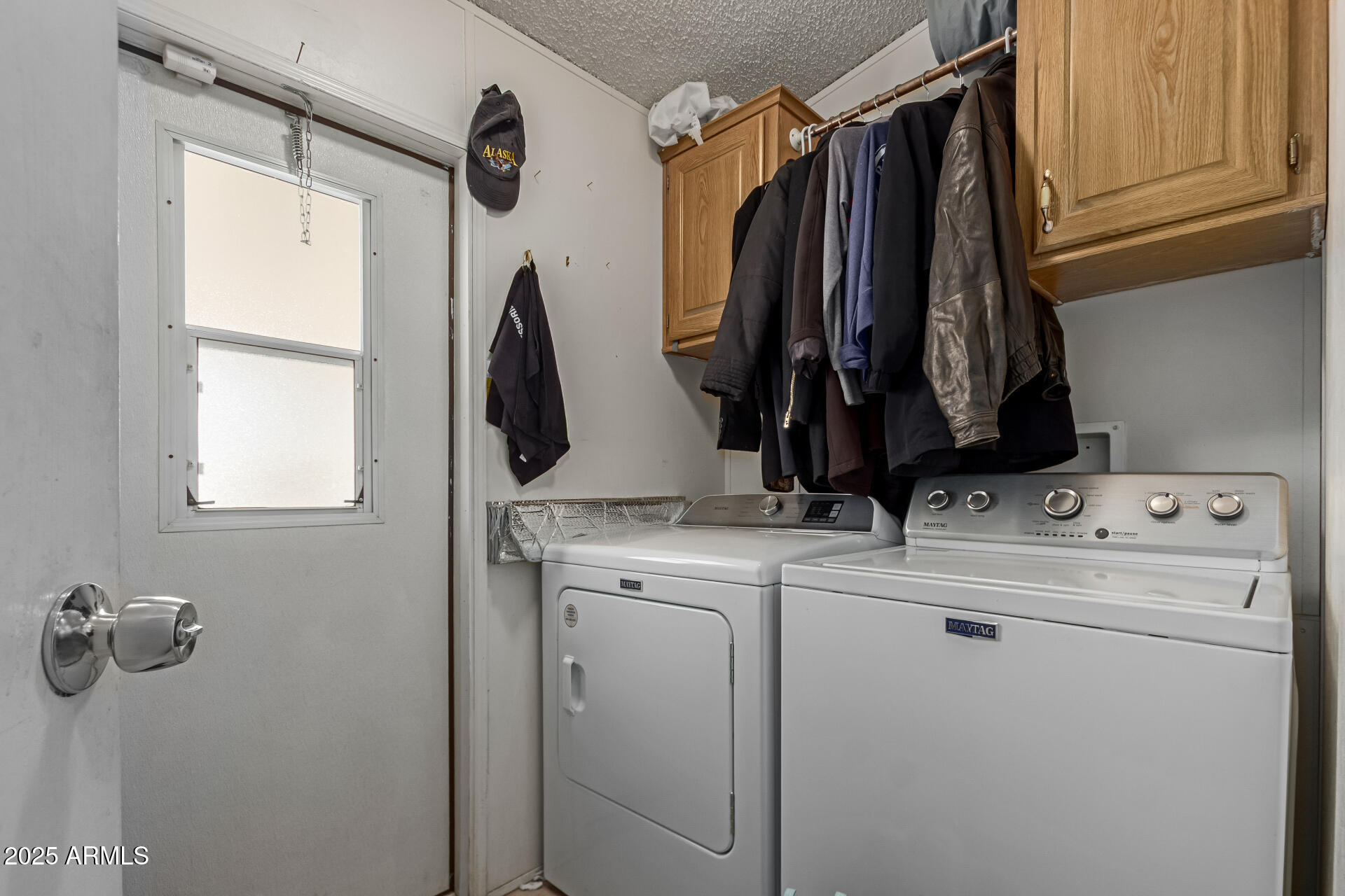 1221 North Dysart Road, Unit 42 Avondale, AZ 85323 - Photo 22 of 23 a view of walk in closet with clothes and shoes