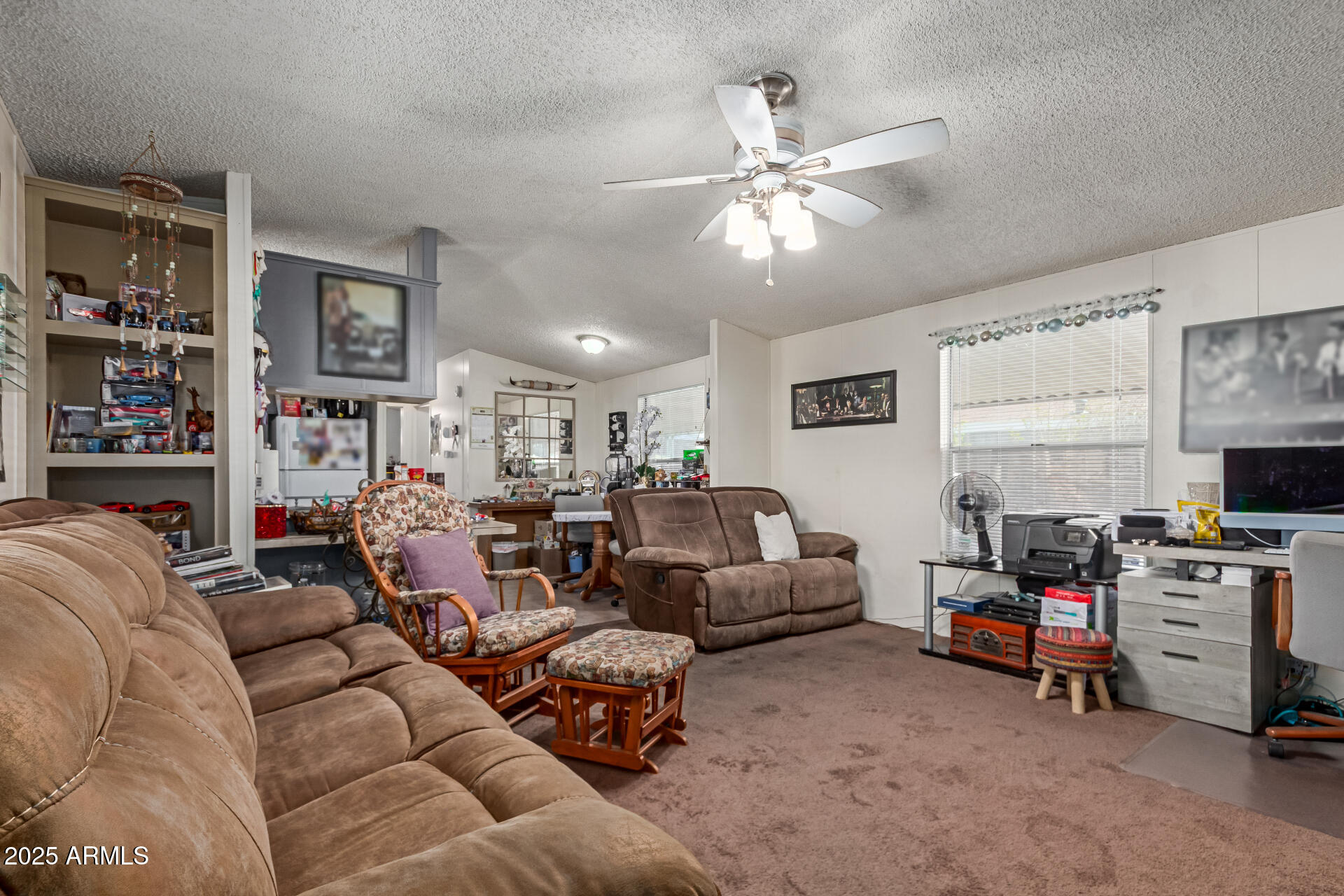 1221 North Dysart Road, Unit 42 Avondale, AZ 85323 - Photo 4 of 23 a living room with furniture and a flat screen tv