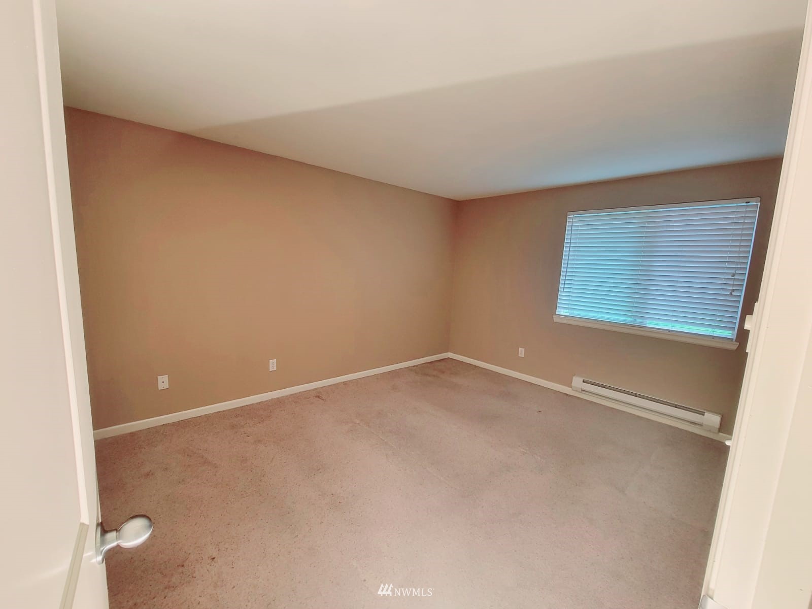 10813 Northeast 147th Lane, Unit N102 Bothell, WA 98011 - Photo 12 of 25 an empty room with a workbench