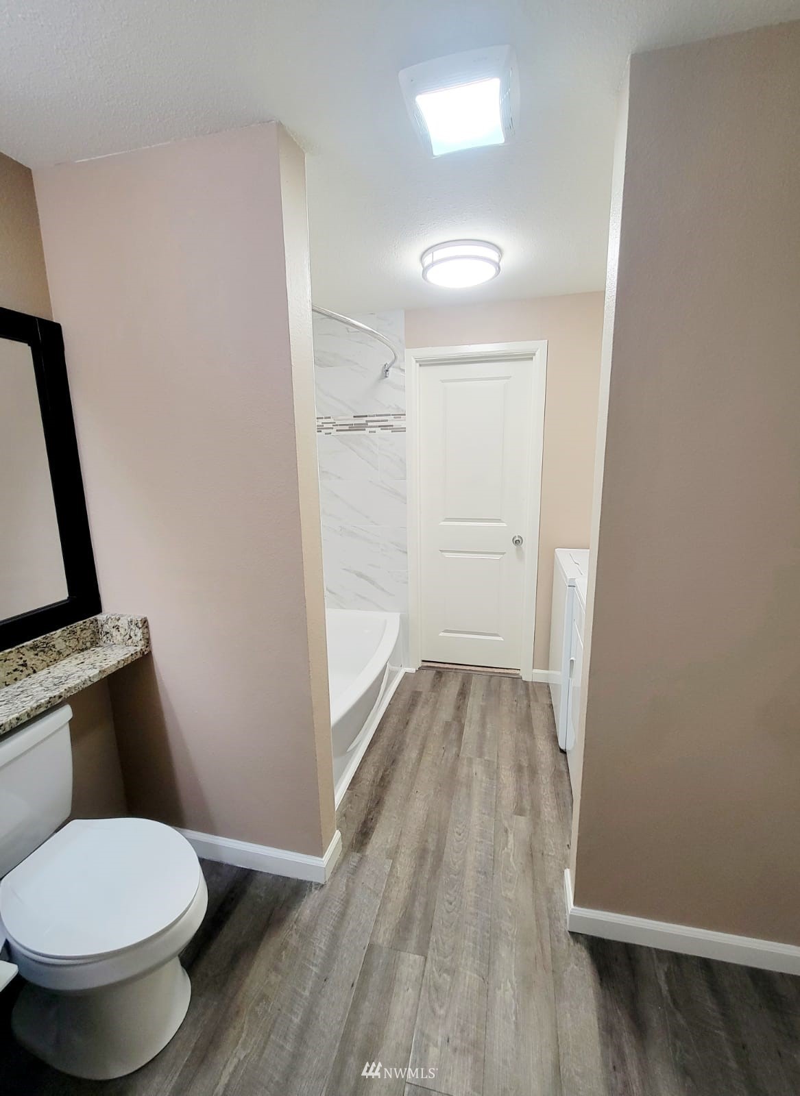 10813 Northeast 147th Lane, Unit N102 Bothell, WA 98011 - Photo 14 of 25 a bathroom with a toilet and a shower
