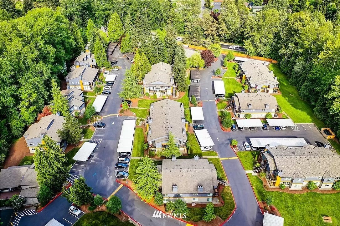 10813 Northeast 147th Lane, Unit N102 Bothell, WA 98011 - Photo 2 of 25 an aerial view of residential houses with outdoor space