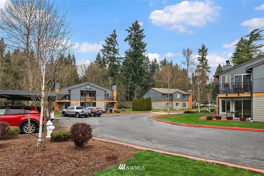 10813 Northeast 147th Lane, Unit N102 Bothell, WA 98011 - Photo 22 of 25 a car parked in front of a house