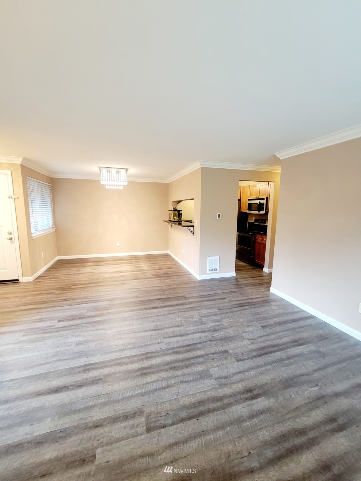 10813 Northeast 147th Lane, Unit N102 Bothell, WA 98011 - Photo 6 of 25 a view of empty room with wooden floor