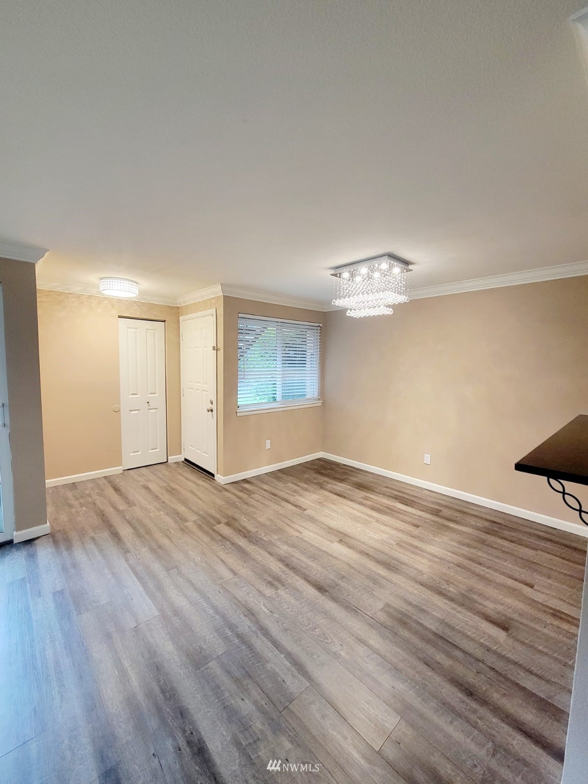 10813 Northeast 147th Lane, Unit N102 Bothell, WA 98011 - Photo 8 of 25 a view of empty room with wooden floor