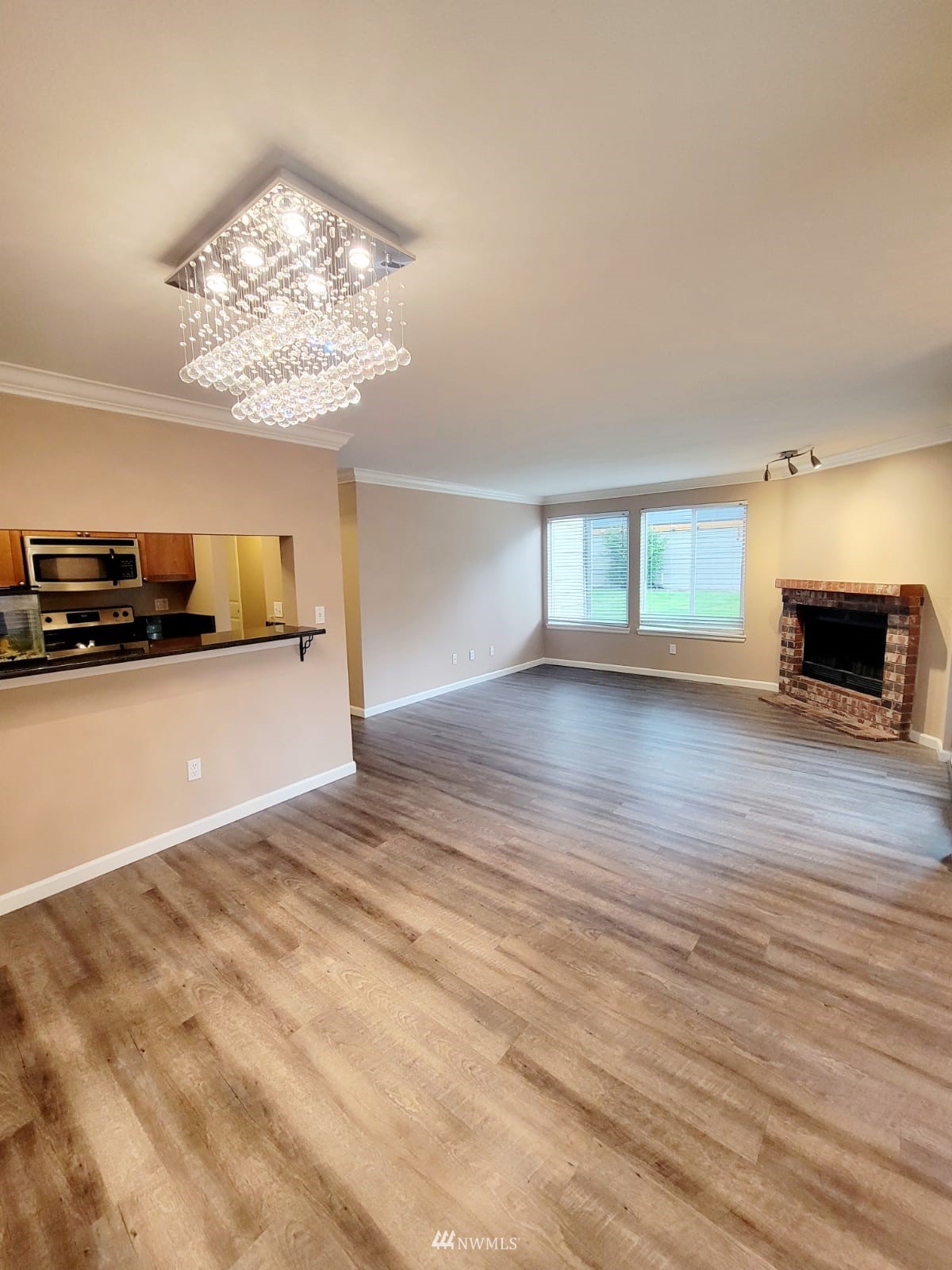 10813 Northeast 147th Lane, Unit N102 Bothell, WA 98011 - Photo 10 of 25 a view of a livingroom with furniture and a fireplace