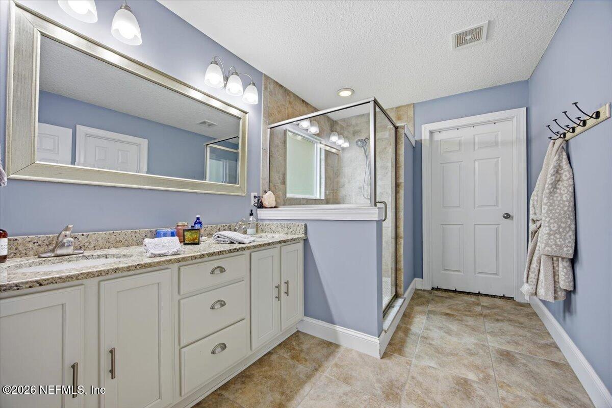 4009 Palm Way Jacksonville Beach, FL 32250 - Photo 15 of 24 a bathroom with a sink a vanity and a mirror