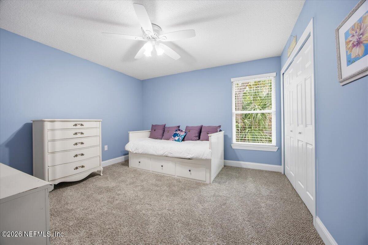 4009 Palm Way Jacksonville Beach, FL 32250 - Photo 18 of 24 a spacious bedroom with a bed and a dresser
