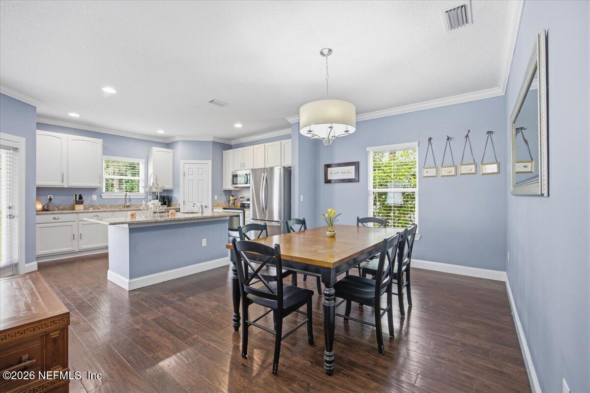4009 Palm Way Jacksonville Beach, FL 32250 - Photo 9 of 24 a large kitchen with a table and chairs