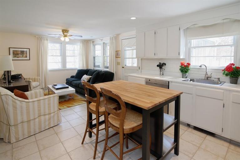 126 Waterfield Road Osterville, MA 02655 - Photo 3 of 28 a kitchen that has a table and chairs in it