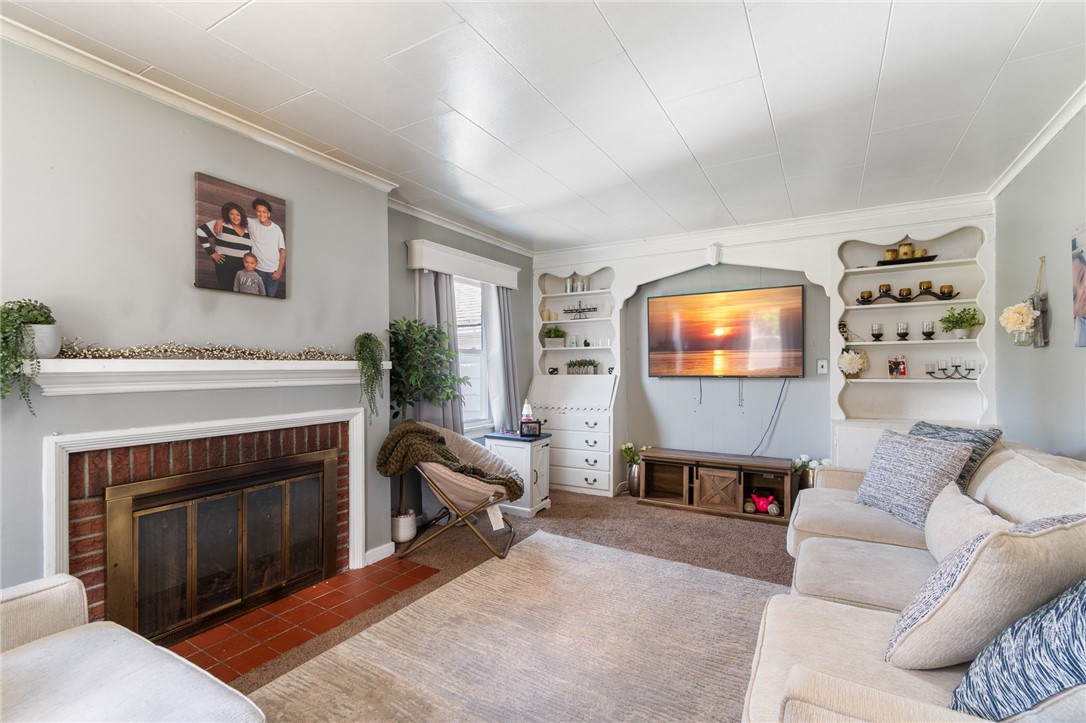 6170 Locust Street Williamson, NY 14589 - Photo 6 of 26 Built in shelving in this spacious living room