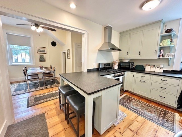 278 East Main Street Plainfield, MA 01070 - Photo 7 of 33 a kitchen with a stove cabinets and a window