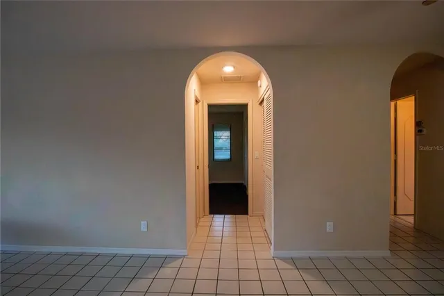 a view of a livingroom with an empty space and window