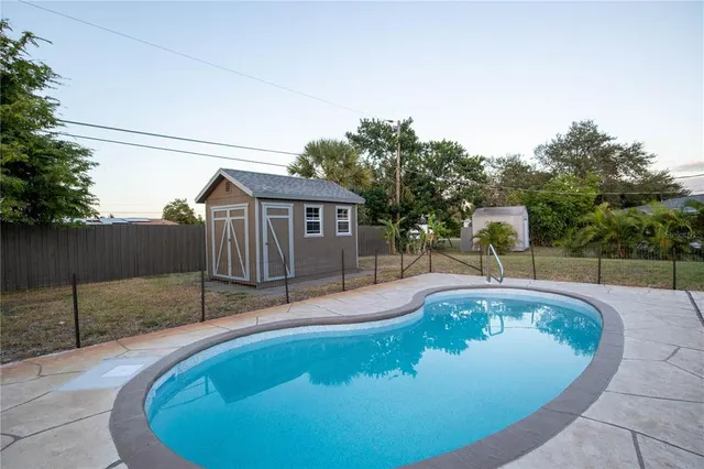 a view of a swimming pool with a patio