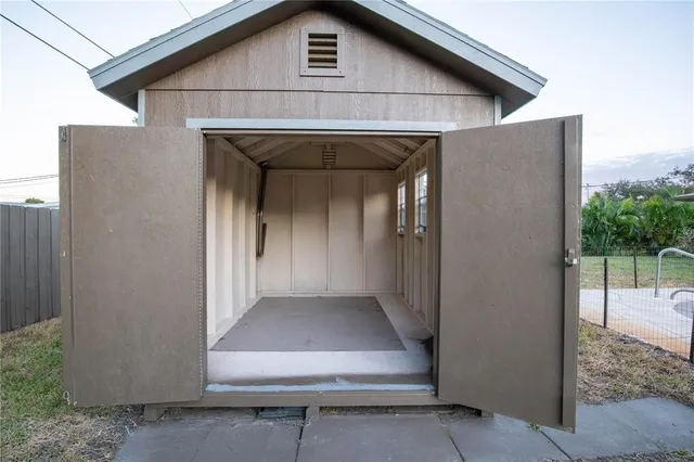 a view of a small house with roof