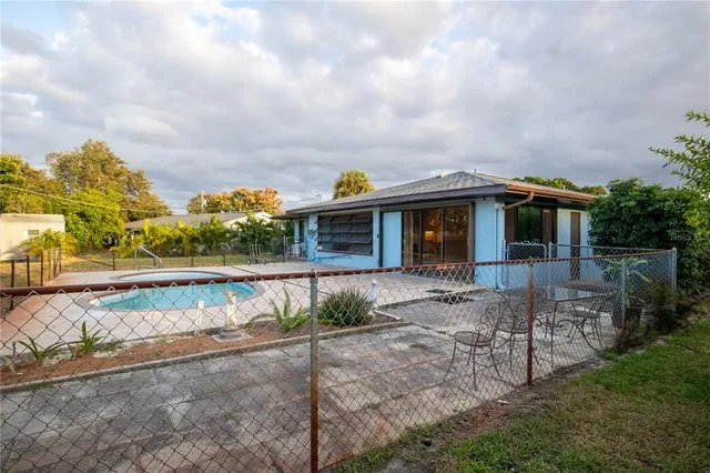 a view of house with outdoor space and sitting area