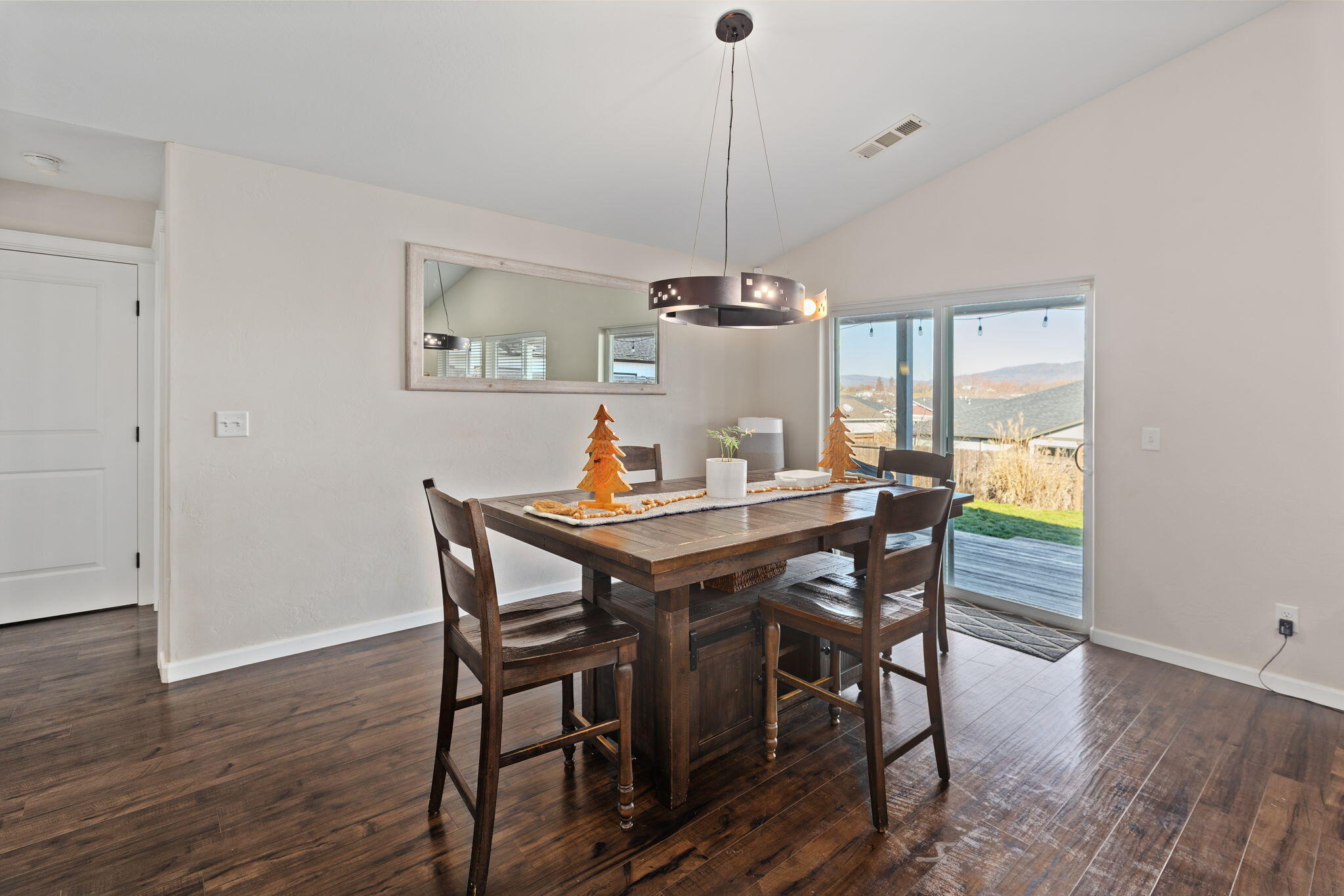 110 Linton Way Eagle Point, OR 97524 - Photo 12 of 41 a view of a dining room with a table and chairs