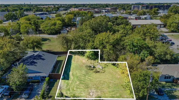 an aerial view of house with yard