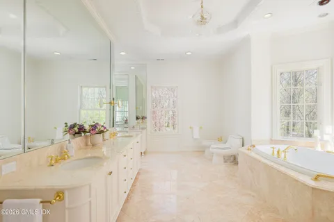 a bath tub sitting next to a window