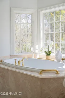 a bathroom with a shower and a sink