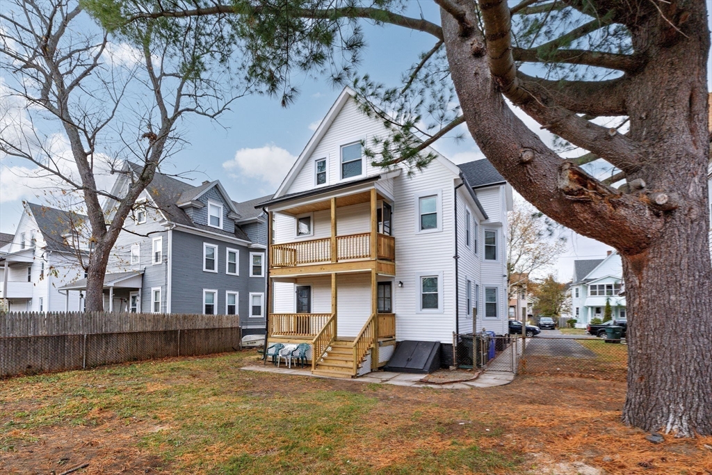 21 Biltmore Street, Unit 1 Springfield, MA 01108 - Photo 15 of 17 a view of a building with a large tree in front