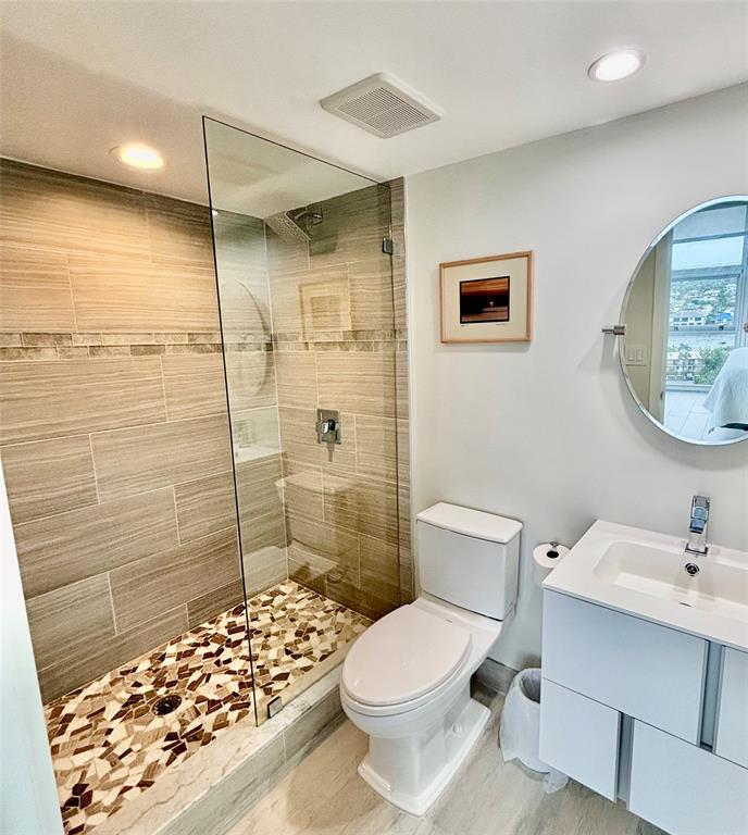 531 North Ocean Boulevard, Unit 1601 Pompano Beach, FL 33062 - Photo 15 of 32 a bathroom with a sink toilet and shower