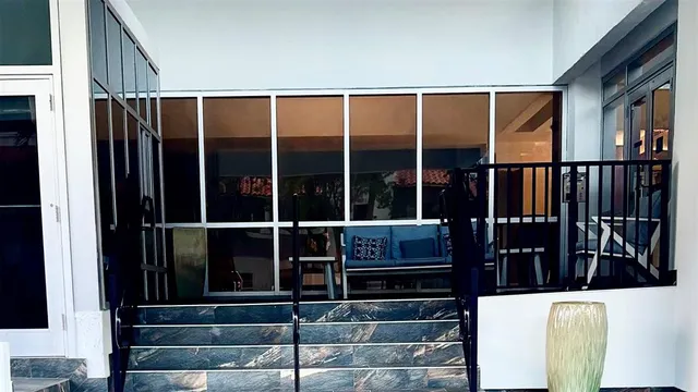 a view of a balcony with chairs