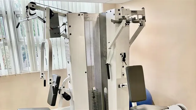 a view of a dining room with furniture and a window