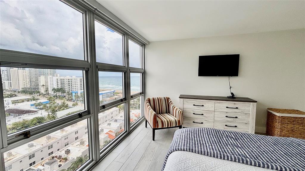 531 North Ocean Boulevard, Unit 1601 Pompano Beach, FL 33062 - Photo 10 of 32 a bedroom with furniture and a large window
