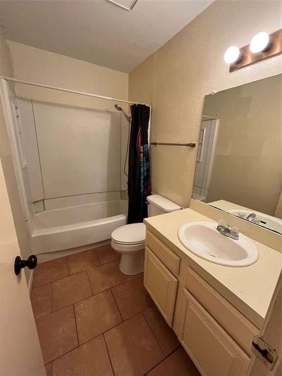4460 Chaha Road, Unit 205 Garland, TX 75043 - Photo 22 of 27 a bathroom with a sink a toilet and shower