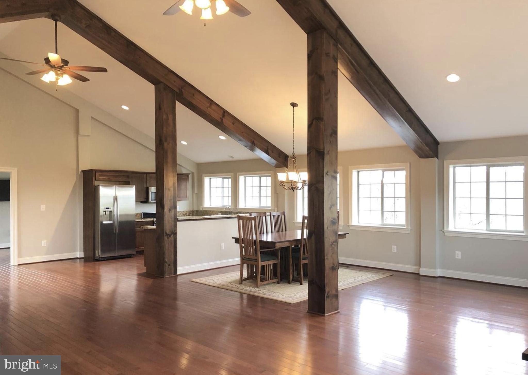 37793 Baker Mill Road, Unit 1 Purcellville, VA 20132 - Photo 14 of 14 a view of a livingroom with furniture and hardwood floor