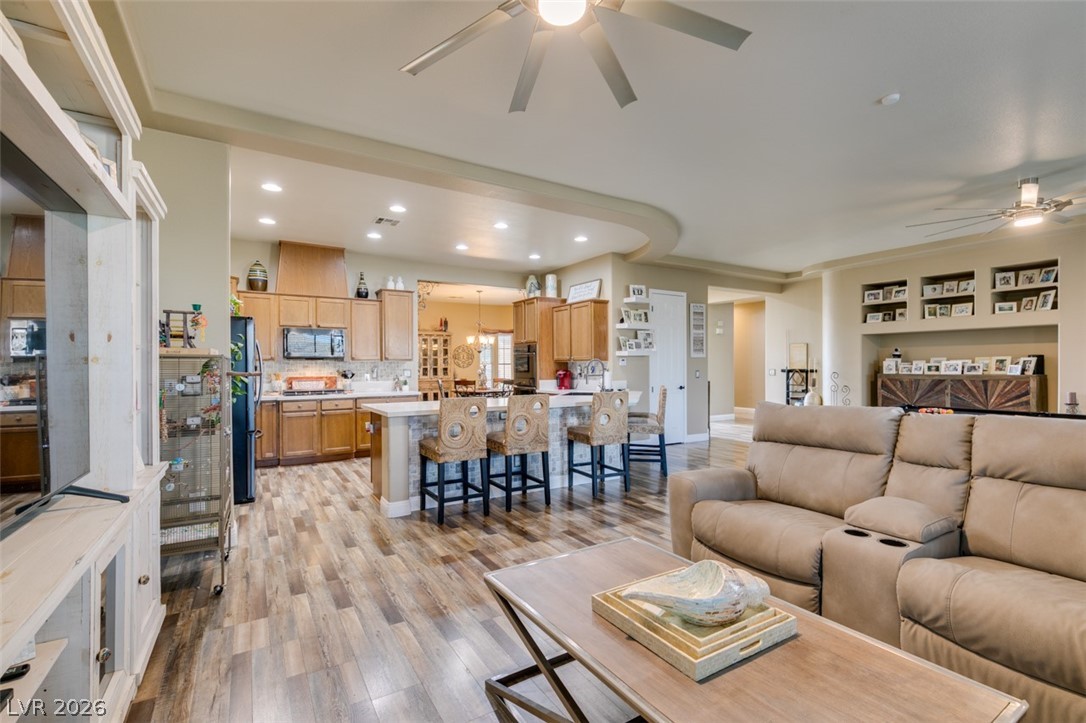 7524 Midnight Rambler Street Las Vegas, NV 89149 - Photo 51 of 51 An open floorplan seamlessly connects the kitchen with a central island to a spacious living area, ideal for entertaining.