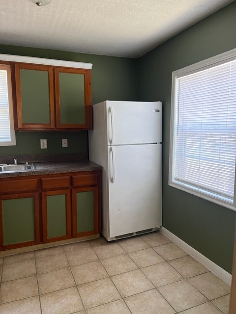 1614 Ryon Street, Unit A Houston, TX 77009 - Photo 1 of 12 a kitchen with a refrigerator and a sink