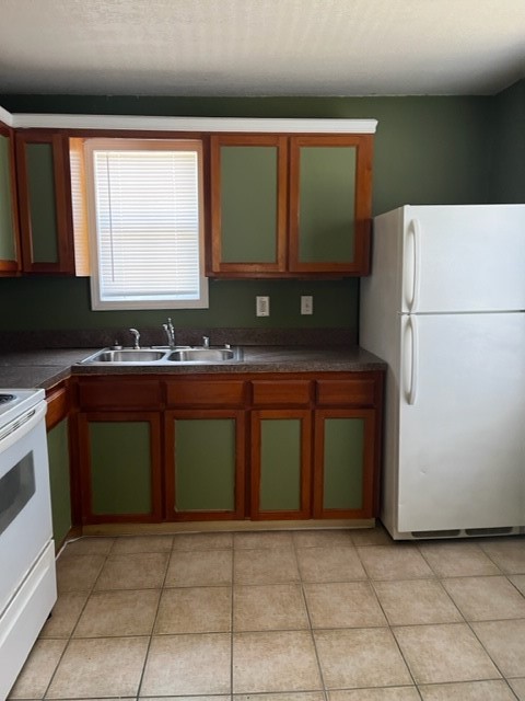 1614 Ryon Street, Unit A Houston, TX 77009 - Photo 2 of 12 a kitchen with a sink a stove and a refrigerator