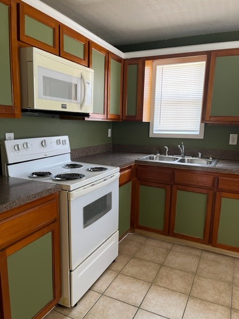 1614 Ryon Street, Unit A Houston, TX 77009 - Photo 3 of 12 a kitchen with a stove sink and microwave