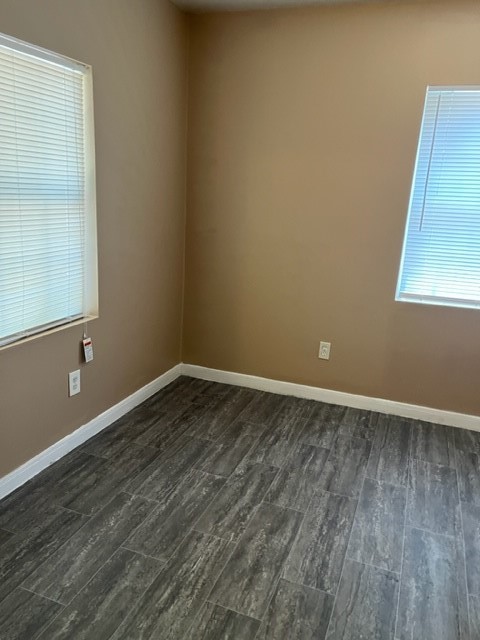 1614 Ryon Street, Unit A Houston, TX 77009 - Photo 8 of 12 an empty room with wooden floor and windows