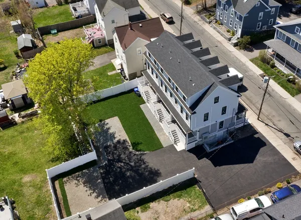 an aerial view of a house with a garden and plants