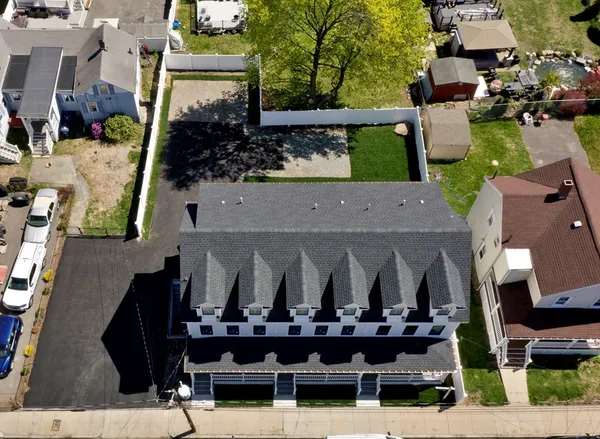 an aerial view of a house with sitting space and garden