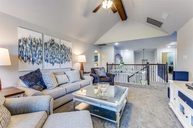 a living room with furniture kitchen view and a table