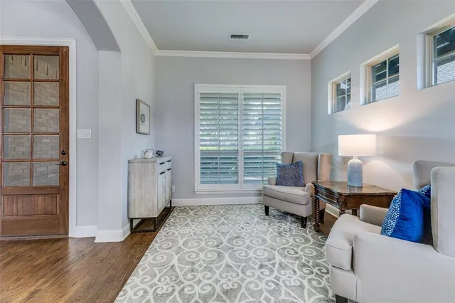 a living room with furniture and a rug