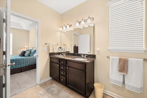 a view of bathroom with dual sinks