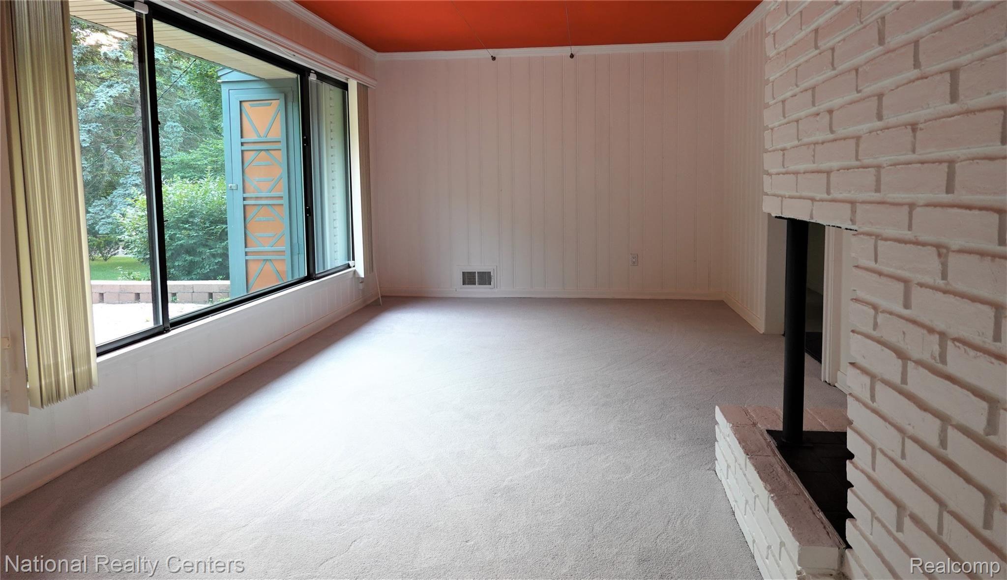 4346 Fieldbrook Road West Bloomfield, MI 48323 - Photo 12 of 23 Family room with new gray carpet and natual fireplace