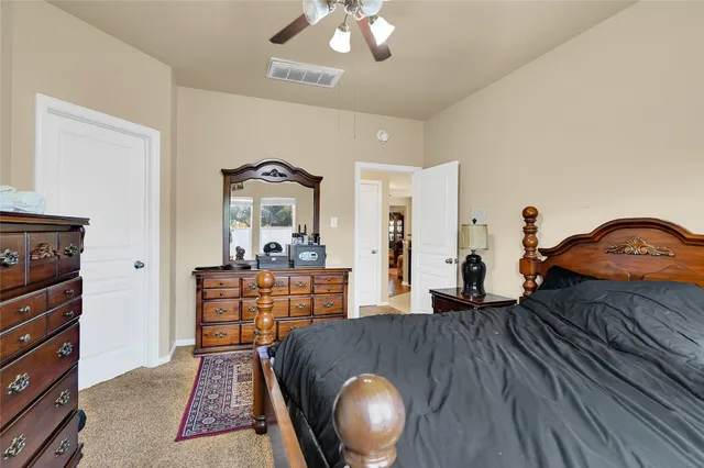 a bedroom with furniture and wooden floor