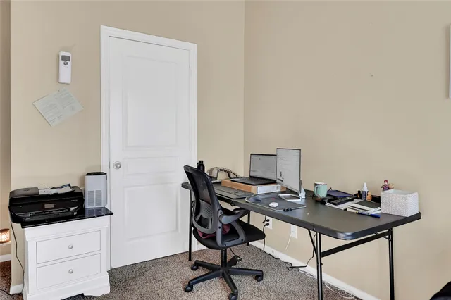 a view of a workspace with furniture