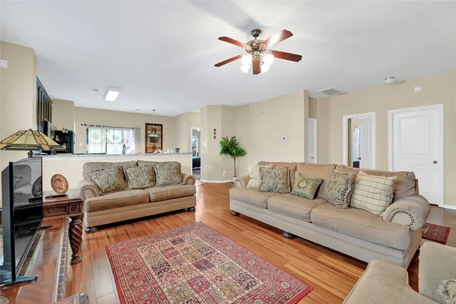 a living room with furniture and a rug