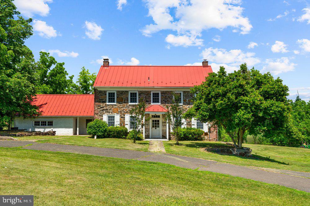 201 East Moyer Road Pottstown, PA 19464 - Photo 1 of 64 a front view of a house with swimming pool and trees